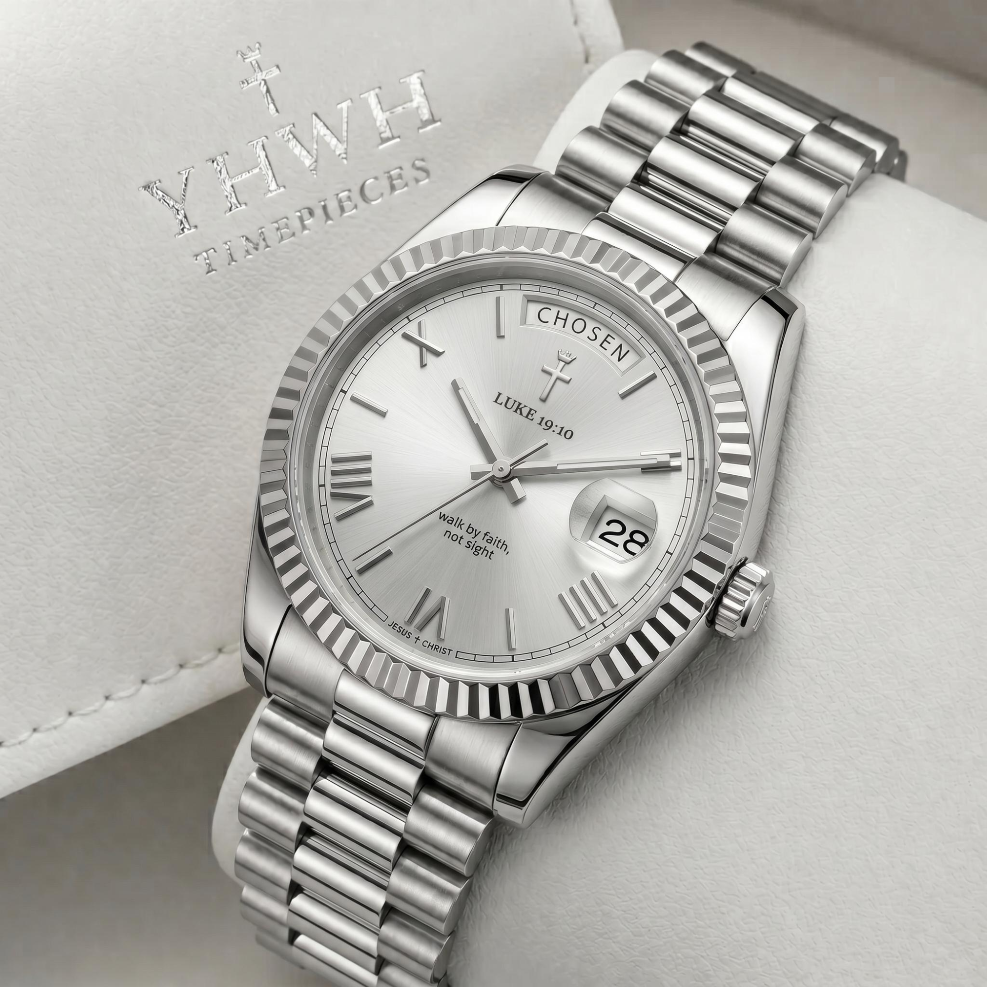 YHWH Timepieces silver watch against its branded presentation background